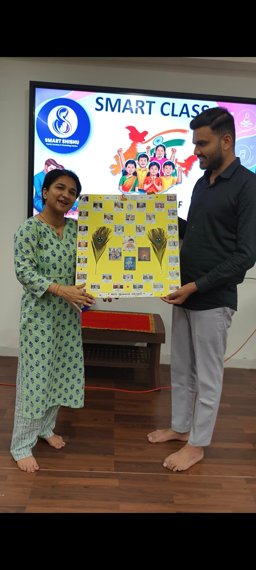 Parent and child presenting a Smart Class values poster